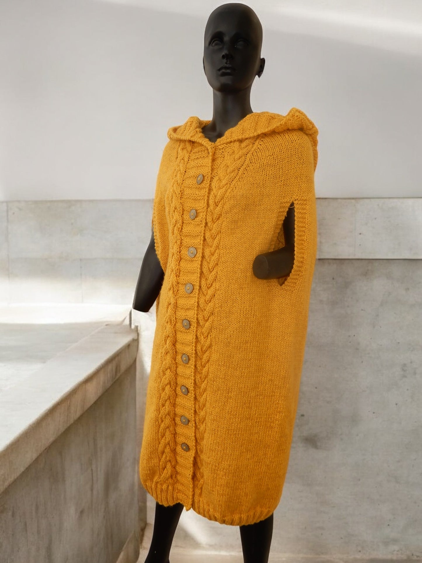 "Unique Handmade Knitted Cape – Warmth with Style"