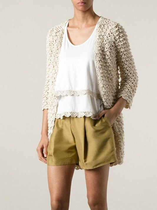 "Clasic Twist" the cardigan that has it all.