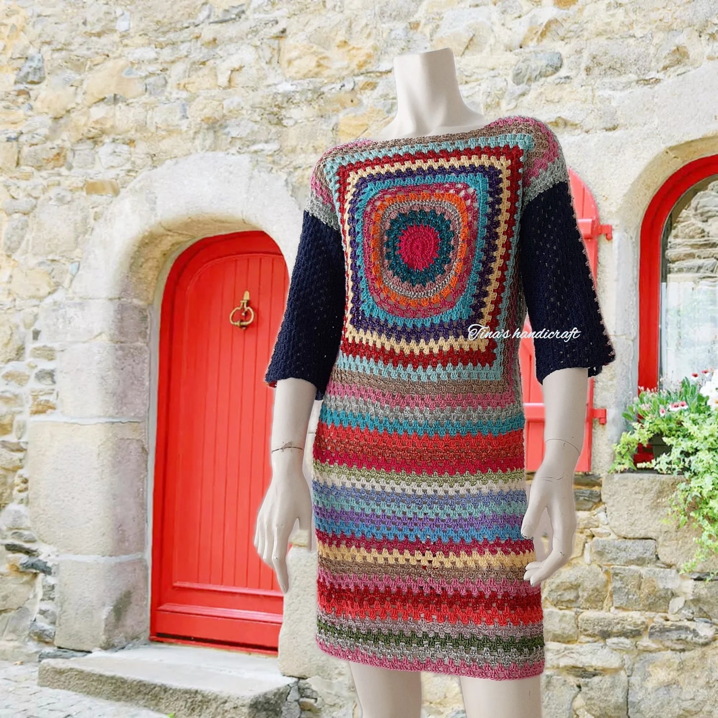 Mini length crochet dress with 3/4 sleeves. The colorful pattern and combination of fabrics make it unique."