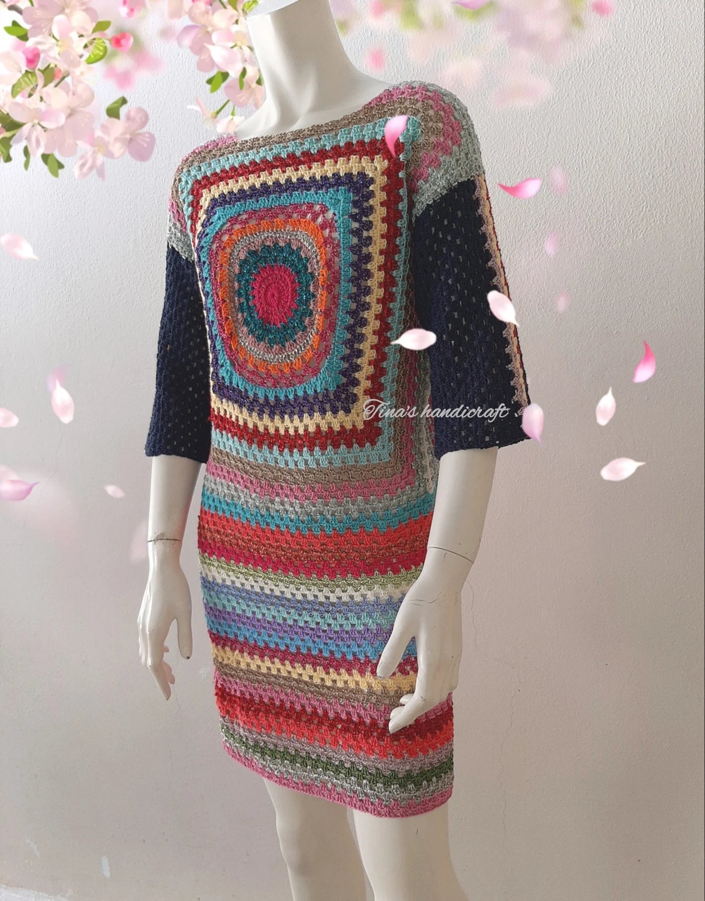 Mini length crochet dress with 3/4 sleeves. The colorful pattern and combination of fabrics make it unique."